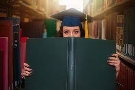 girl with book and mortarboard cap